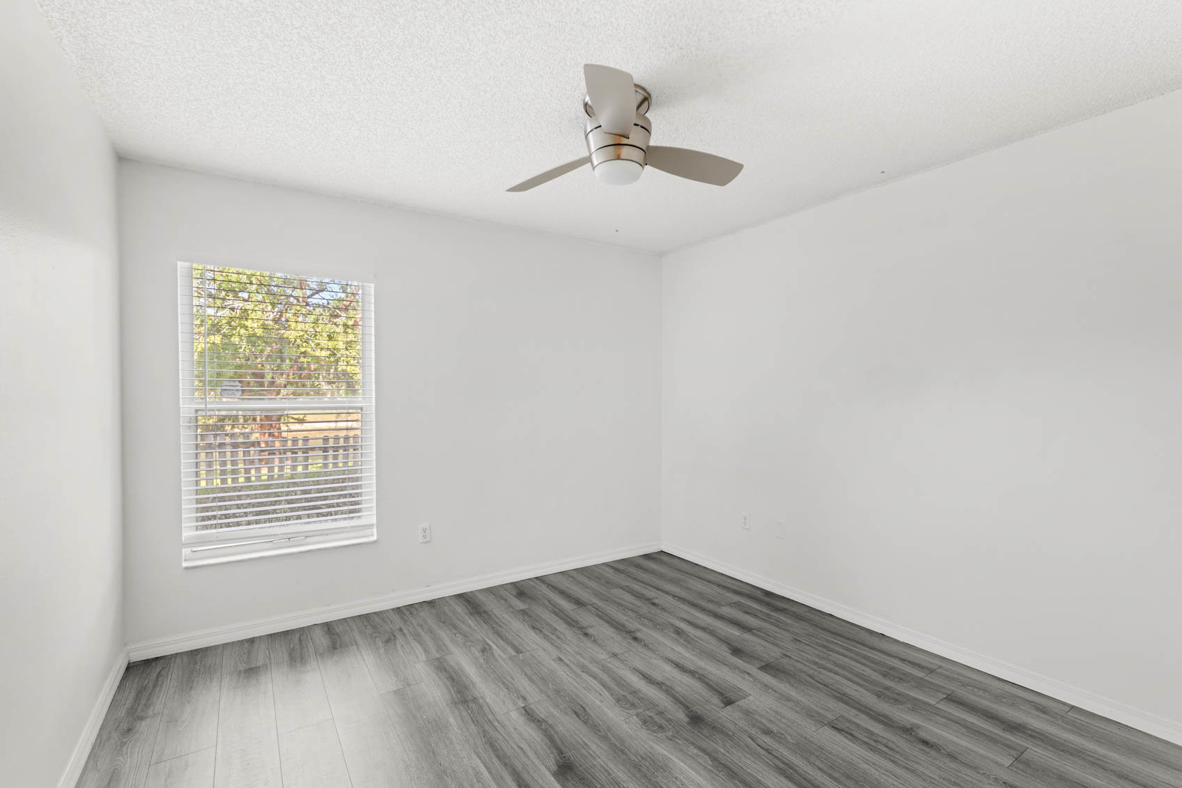 bedroom with grey wooden floors